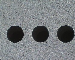 Figure 9 500 µm holes in SiC 750 µm Center to Center, 3.1 mm Deep