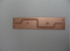 40GHz Waveguides on Aluminum Oxide with Laser Drilled Holes